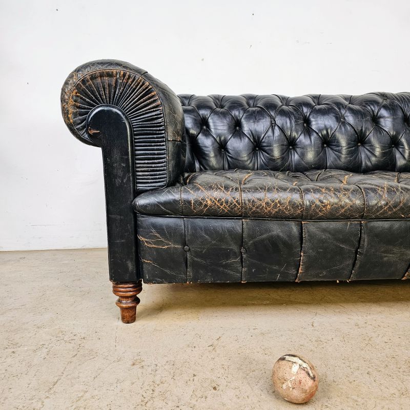 Elegant black Chesterfield sofa circa 1900. Alternate view