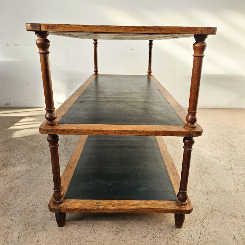 Pair of oak presentation tables from a Parisian store, black moleskin top. Alternate view