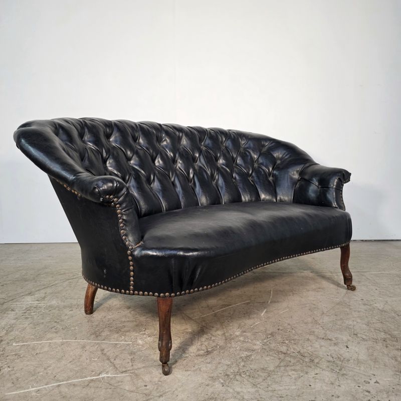 Curved Napoleon III black moleskin sofa